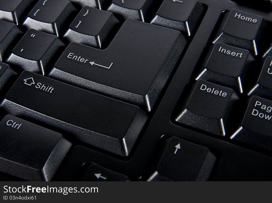 Close up enter key on black computer keyboard