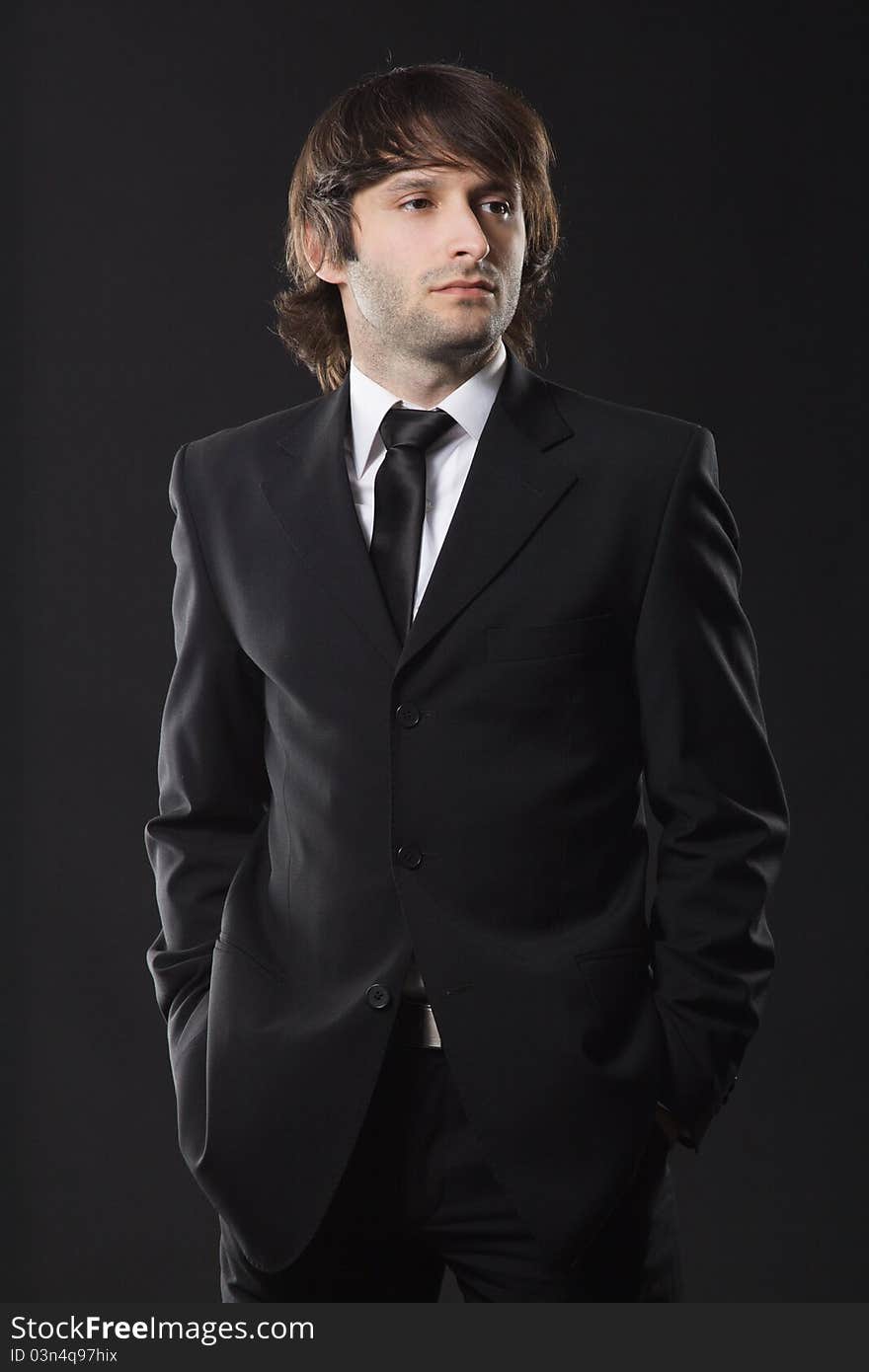 Handsome young man in business suit, studio photo