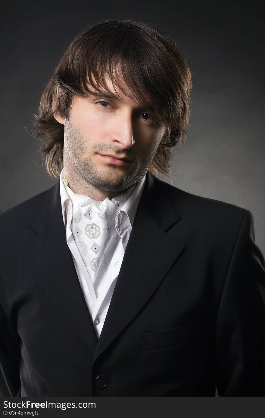 Handsome young man in business suit, studio photo