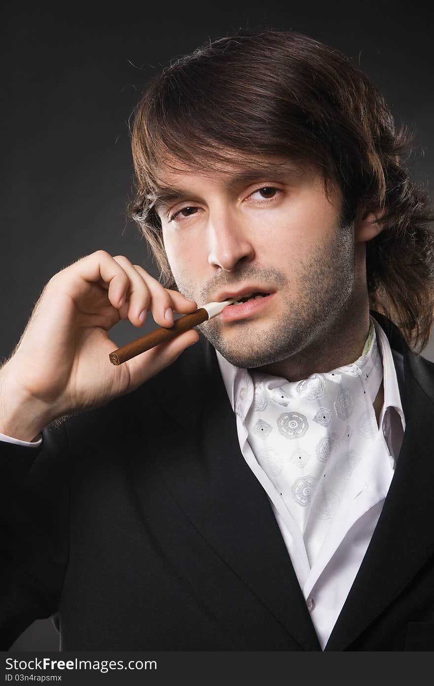 Handsome young man in business suit, studio photo