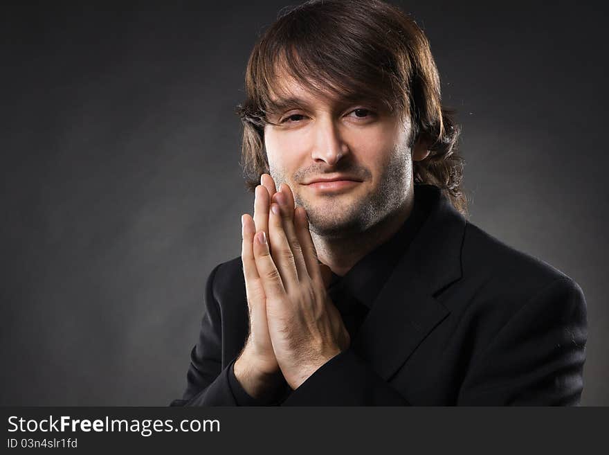 Handsome young man in business suit, studio photo