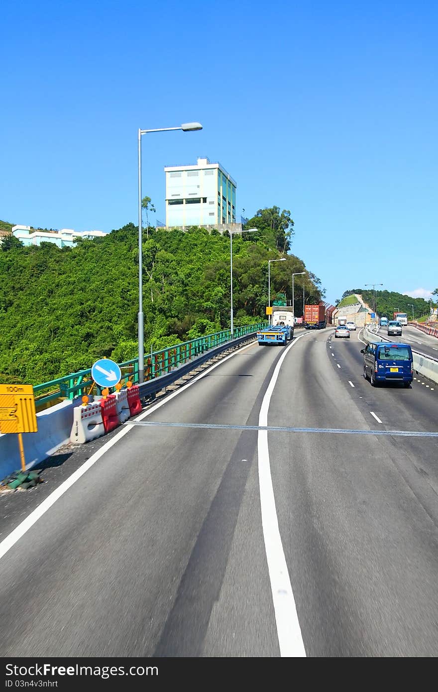 Highway in Hong Kong at day with moving cars