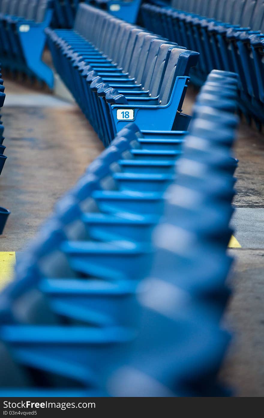 Empty stadium seats during a ball game. Empty stadium seats during a ball game