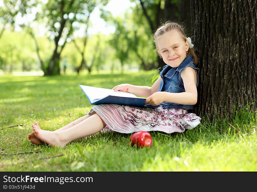 Portrait Of A Little Girl In The Park