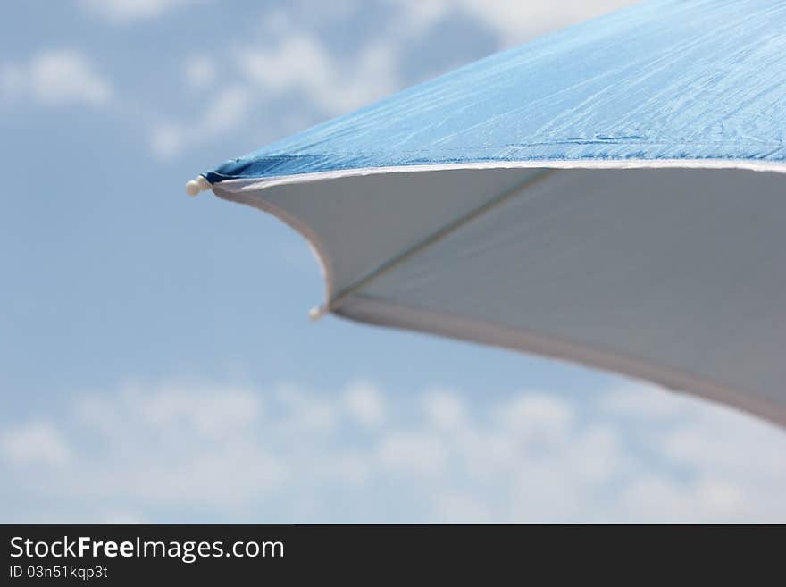 Blue parasol, hot summer day