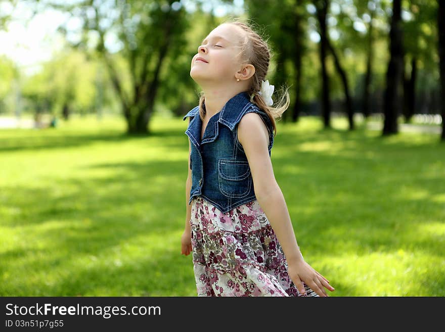 Portrait Of A Little Girl In The Park