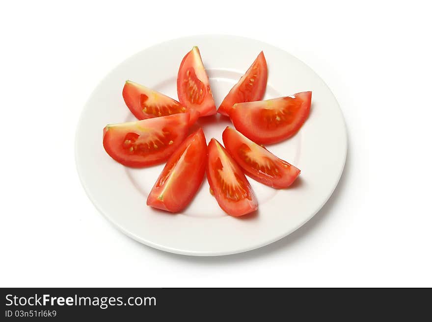 Sliced tomatoes on white plate. Sliced tomatoes on white plate