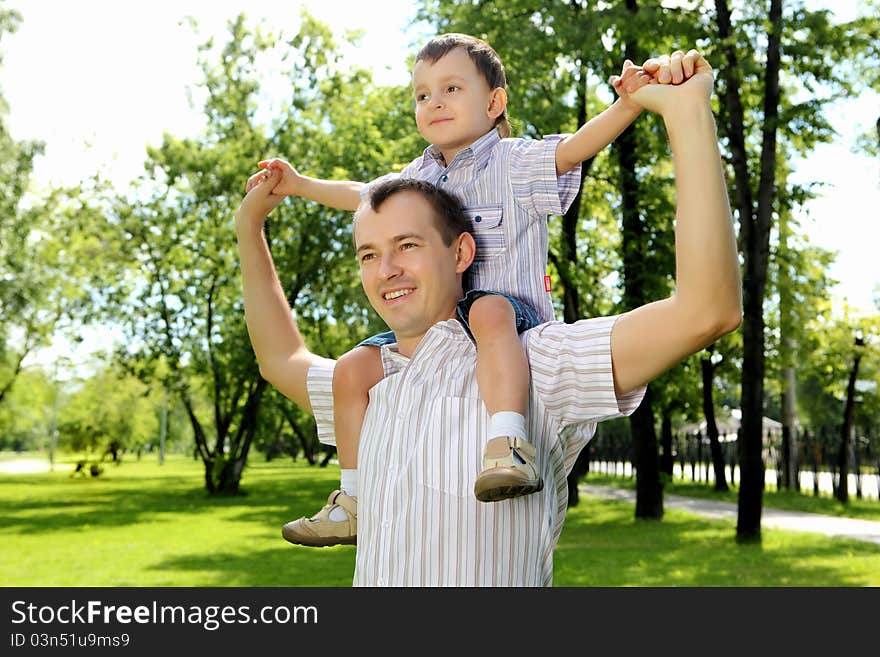 Father with his son in the summer park. Father with his son in the summer park