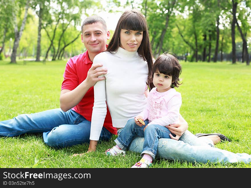 Parents with daughter together in the summer park. Parents with daughter together in the summer park