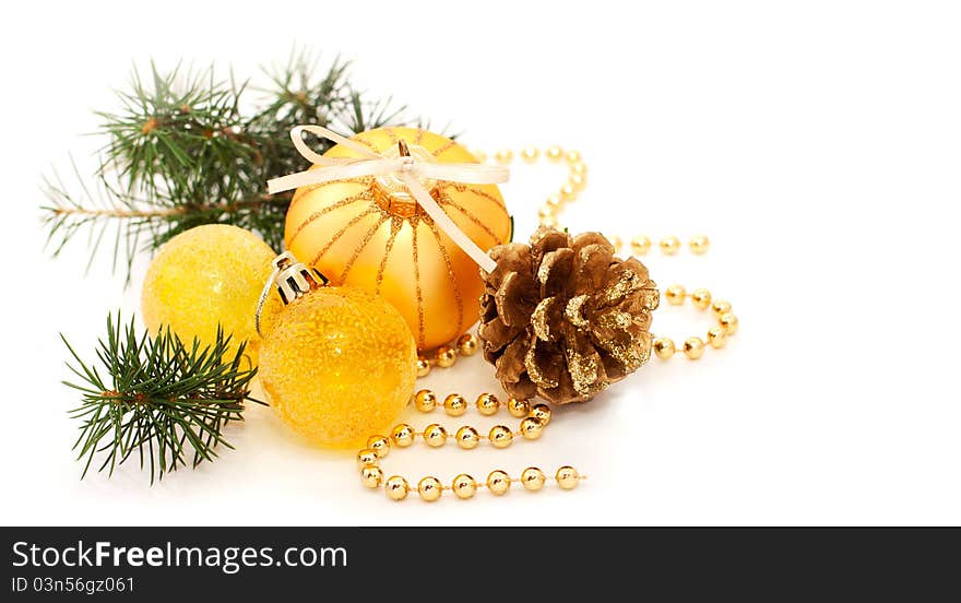 Pine branch and Christmas gold decorations