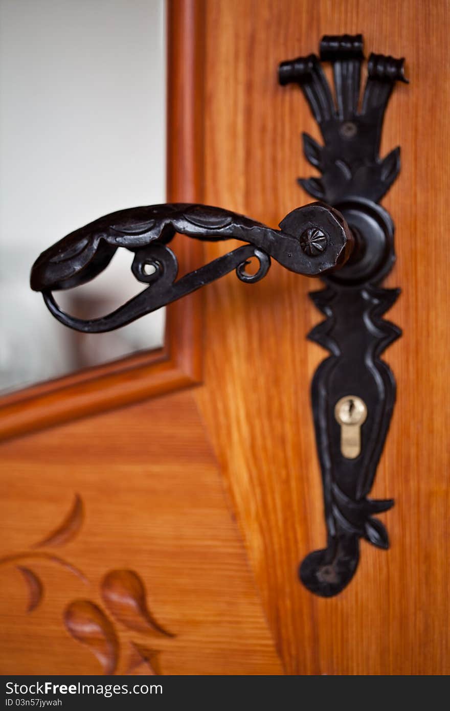 Old forged black door handle. Old forged black door handle