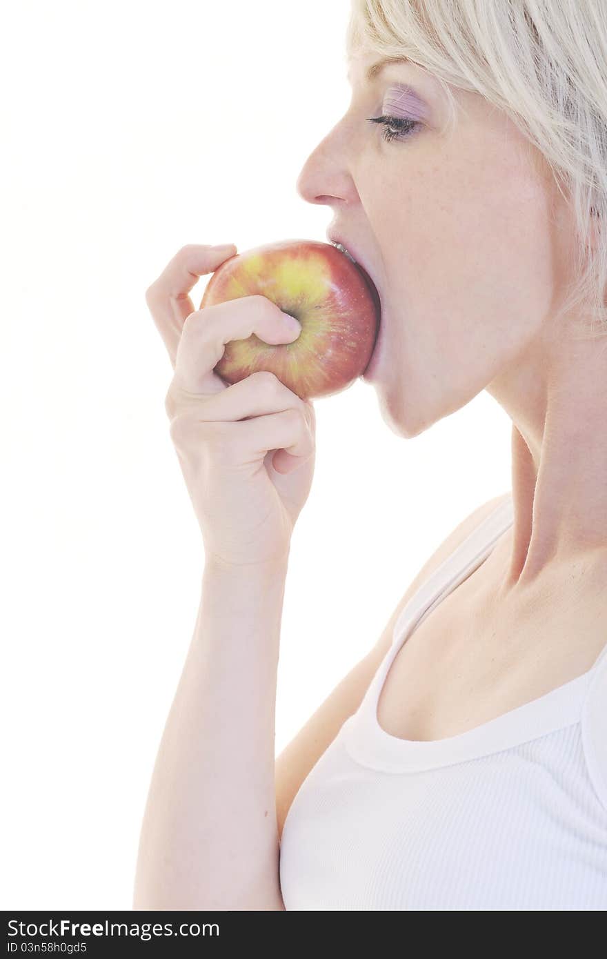 Woman eat green apple isolated on white backround in studio representing healthy lifestile and eco food concept. Woman eat green apple isolated on white backround in studio representing healthy lifestile and eco food concept