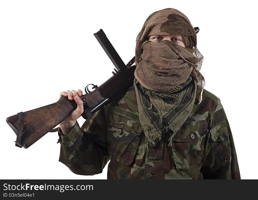 Camouflaged guerrilla soldier with hidden face and a machine gun. Isolated on white background. Camouflaged guerrilla soldier with hidden face and a machine gun. Isolated on white background.