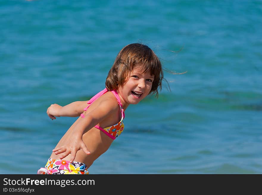 Smiling kid playing on the beach. Smiling kid playing on the beach