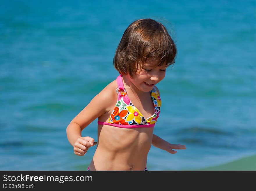 Smiling kid playing on the beach. Smiling kid playing on the beach