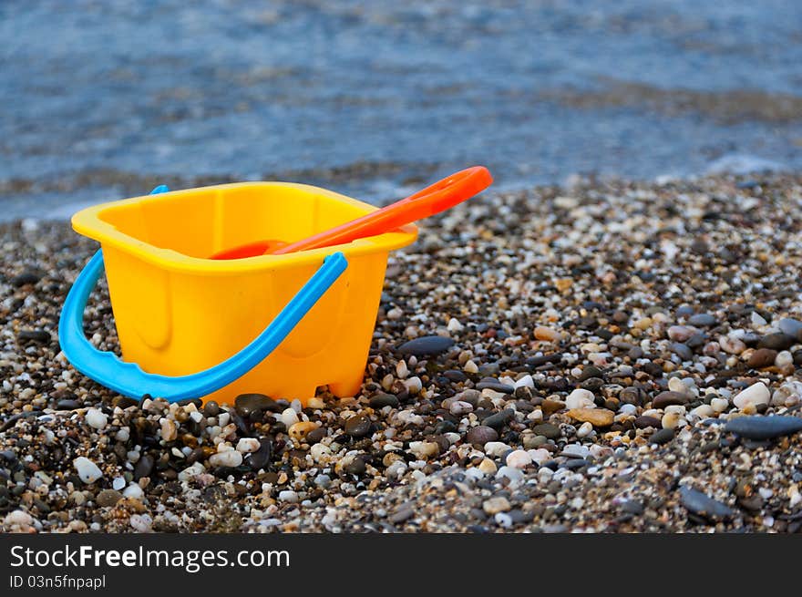 Colorful beach toys near sea. Colorful beach toys near sea