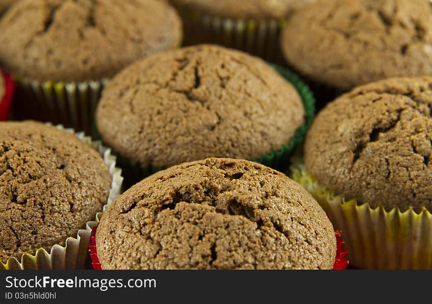 Brown tasty chocolate muffins background