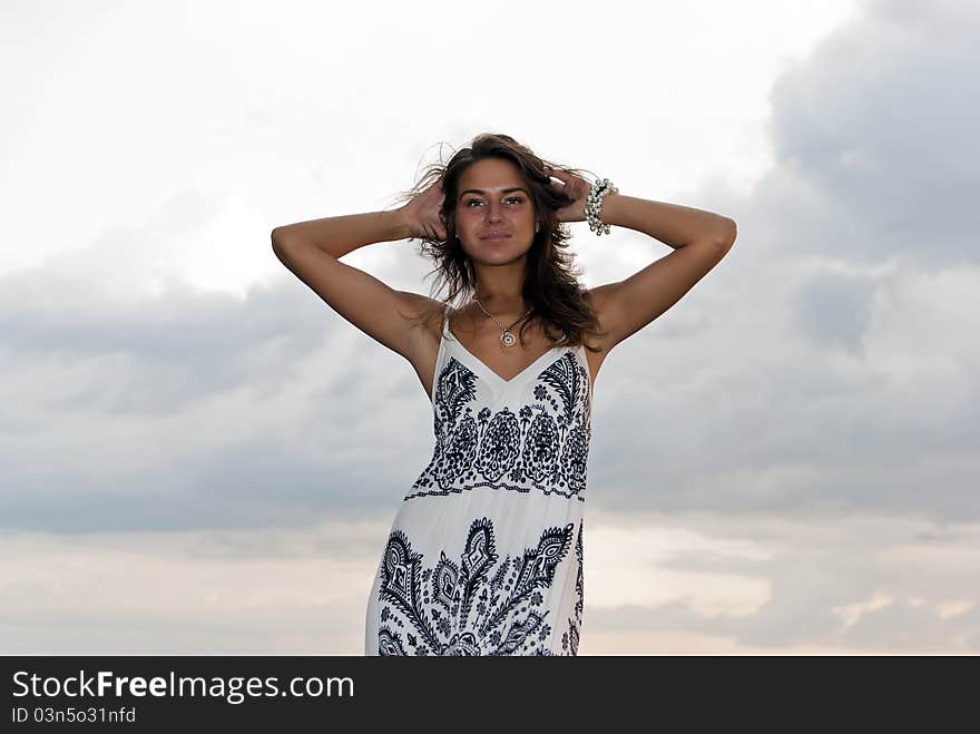 Girl poses against the sky