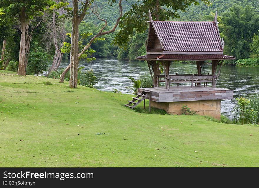 Thai wooden house near the river