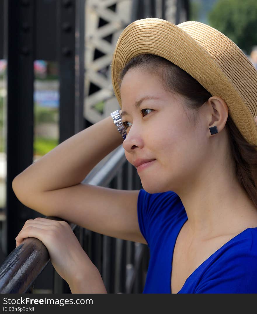 Beautiful asian woman on the iron bridge in thailand