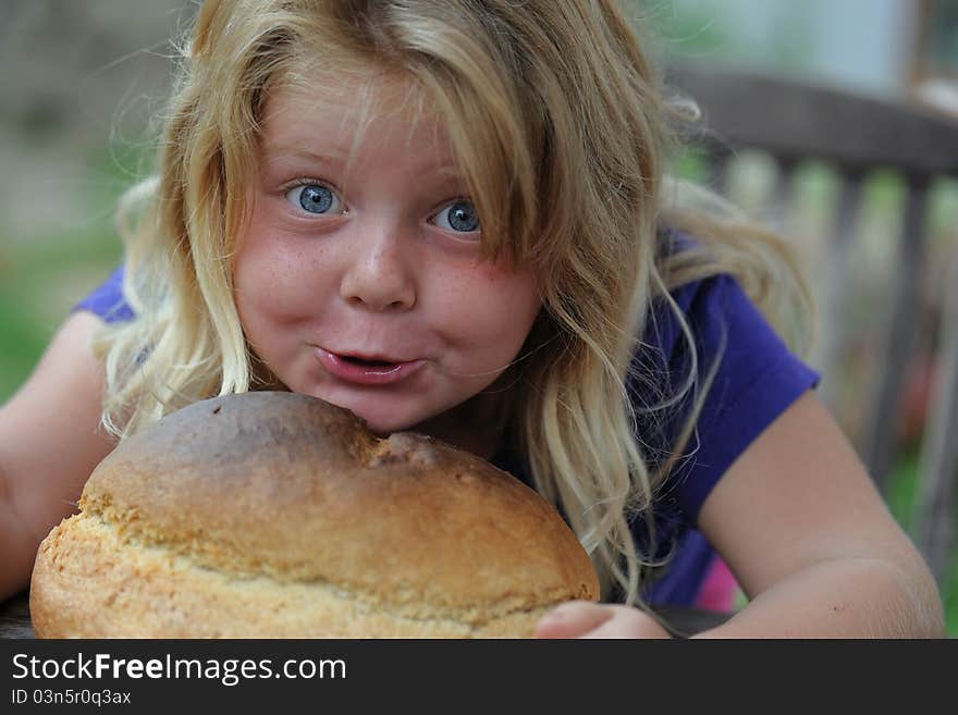 Girl with loaf of bread.