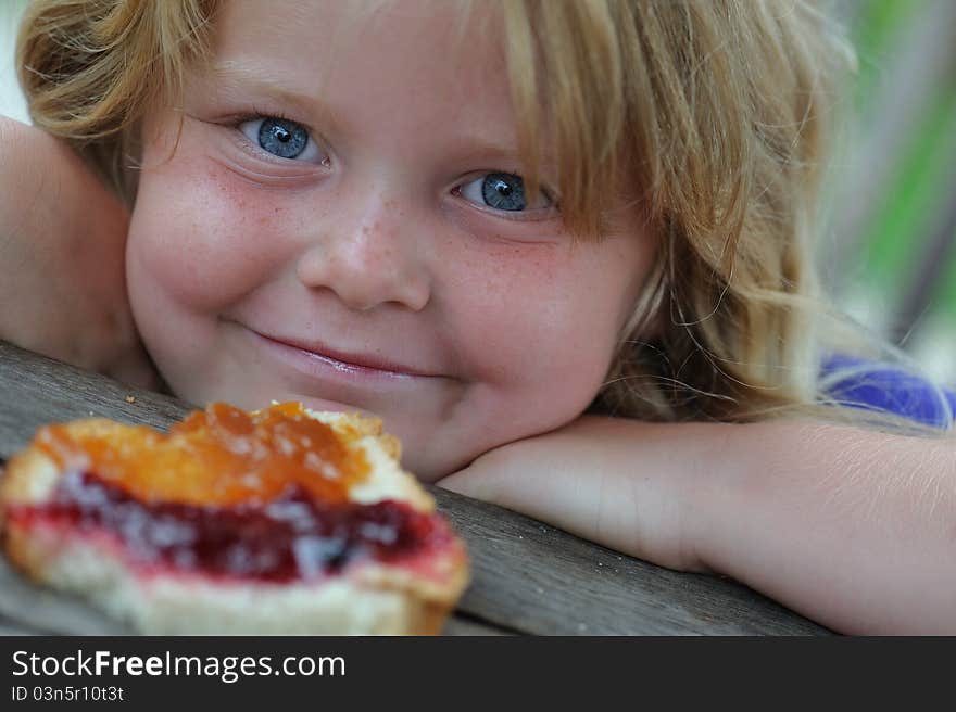 Girl with slice of bread.