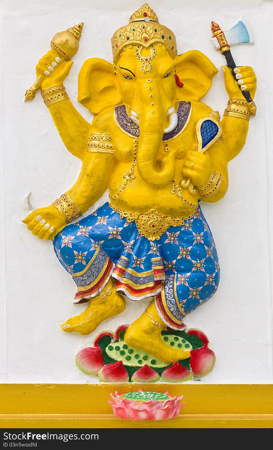 Indian or Hindu God Ganesha avatar image in stucco low relief technique with vivid color,Wat Samarn,Thailand.