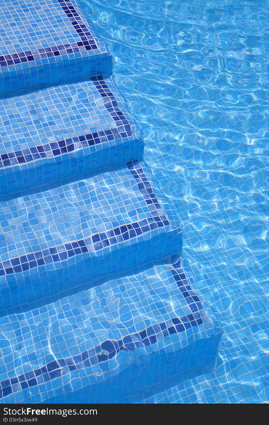 Swimming pool stairs blue background