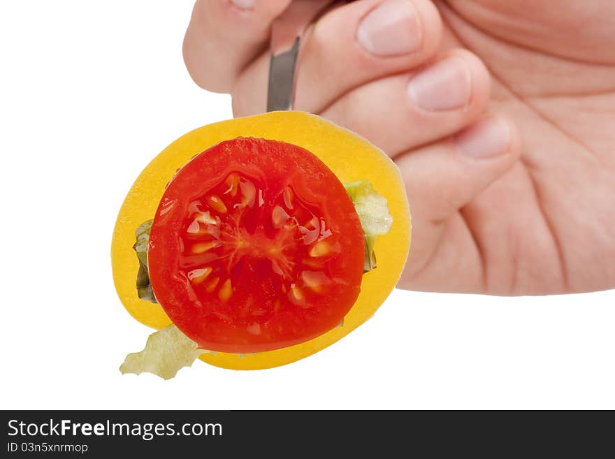 Sandwich of tomato, peppers and lettuce on a fork. Sandwich of tomato, peppers and lettuce on a fork.