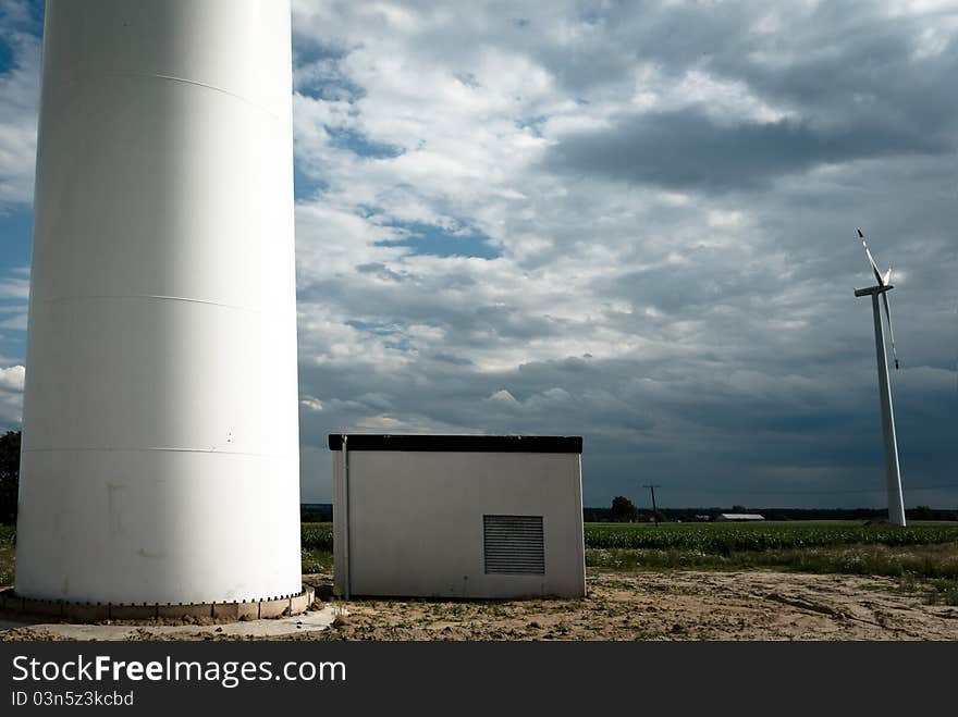 Wind turbines on green field. Alternative source of energy. Wind turbines on green field. Alternative source of energy