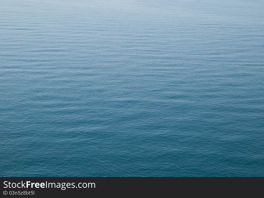 Blue sea surface with waves and ripples. Blue sea surface with waves and ripples.