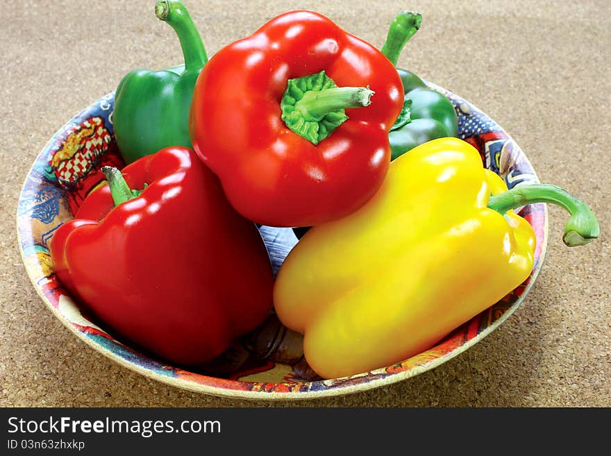 Fresh green, yellow and red peppers