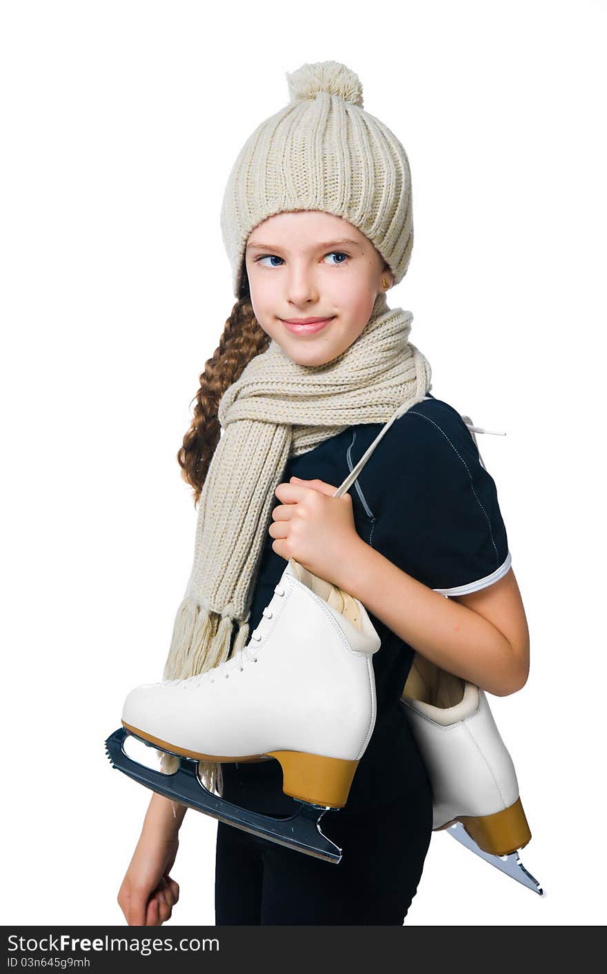 Cute little girl in warm hat with figure skates on white background. Cute little girl in warm hat with figure skates on white background