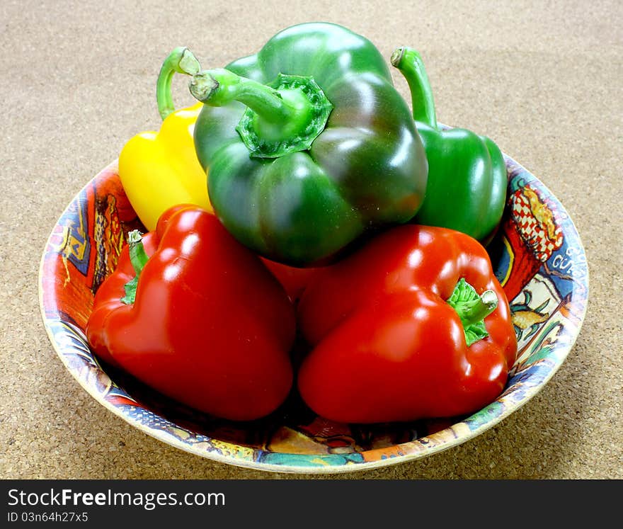 Fresh green, yellow and red peppers