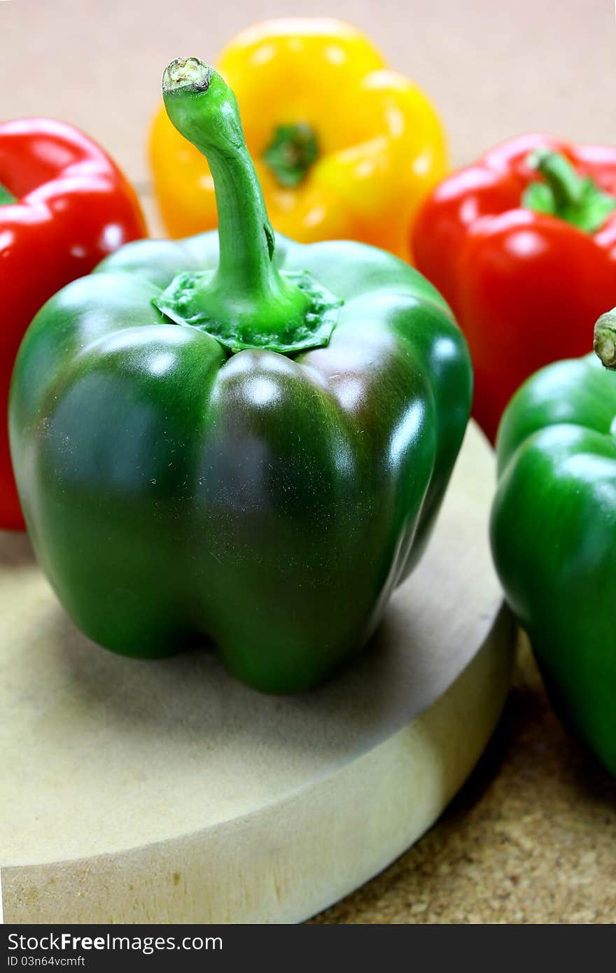 Fresh green, yellow and red peppers