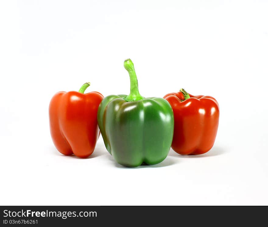 Fresh green and red pepper on white background. Fresh green and red pepper on white background