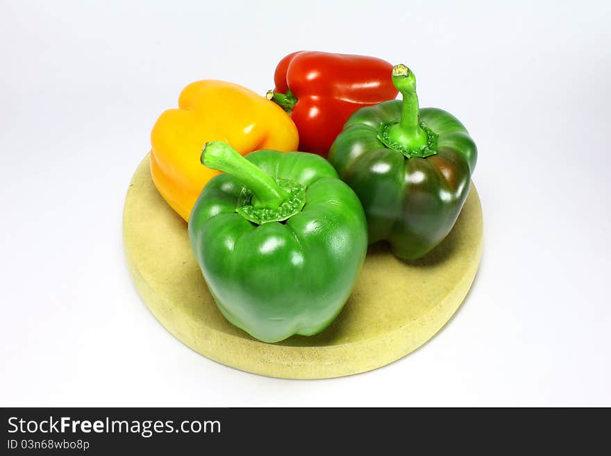 Fresh green, yellow and red peppers