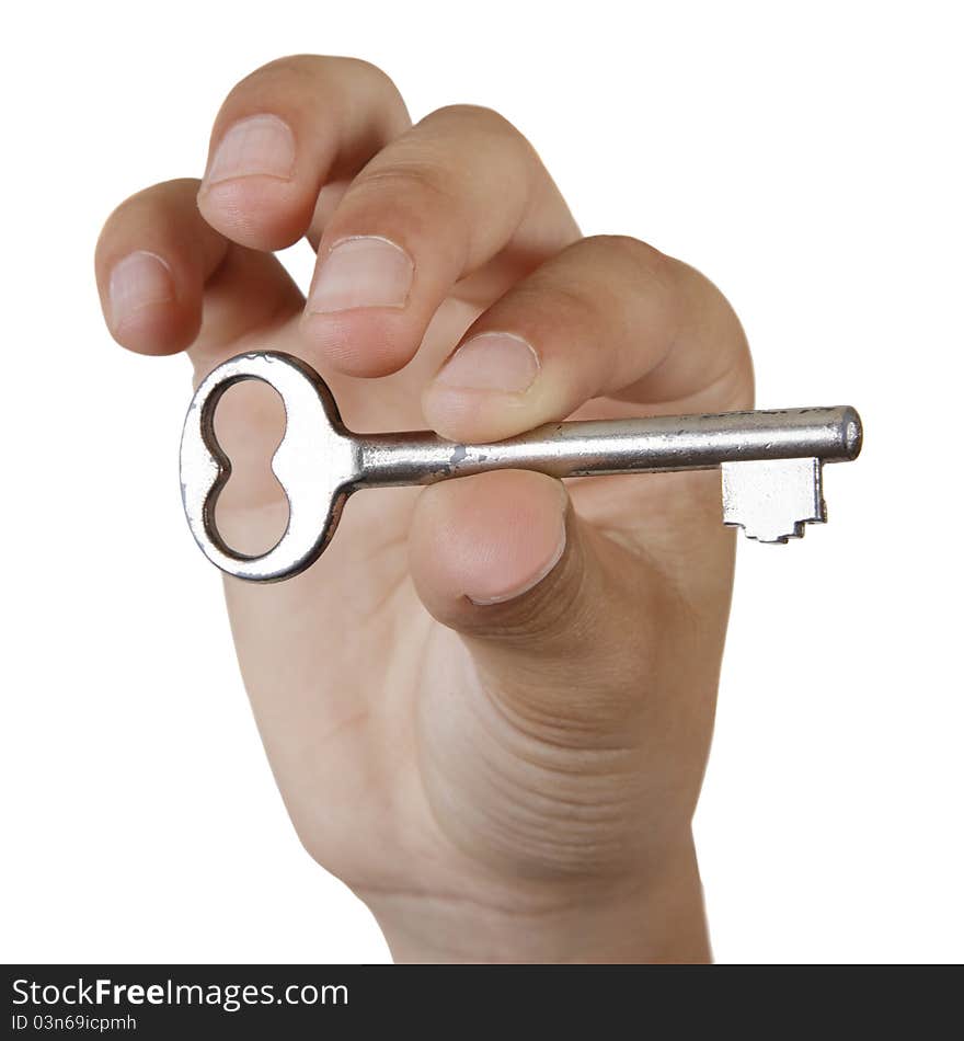 Boy's hand holding a key. Isolated on white background