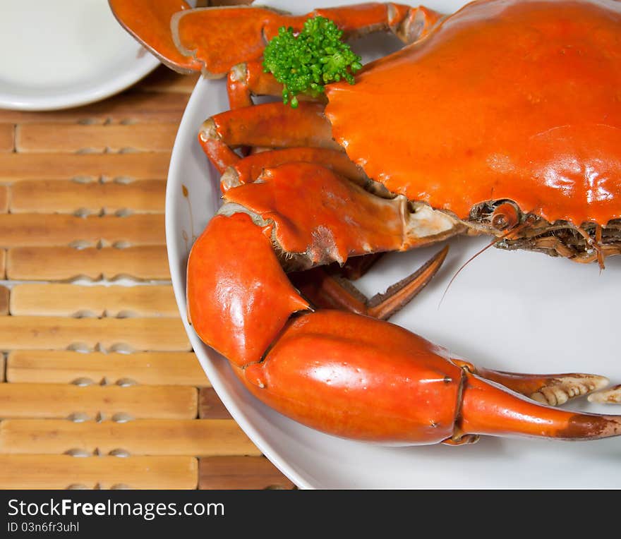 This is a dish of delicious crab, rosy and, green broccoli ornament on it. This is a dish of delicious crab, rosy and, green broccoli ornament on it.