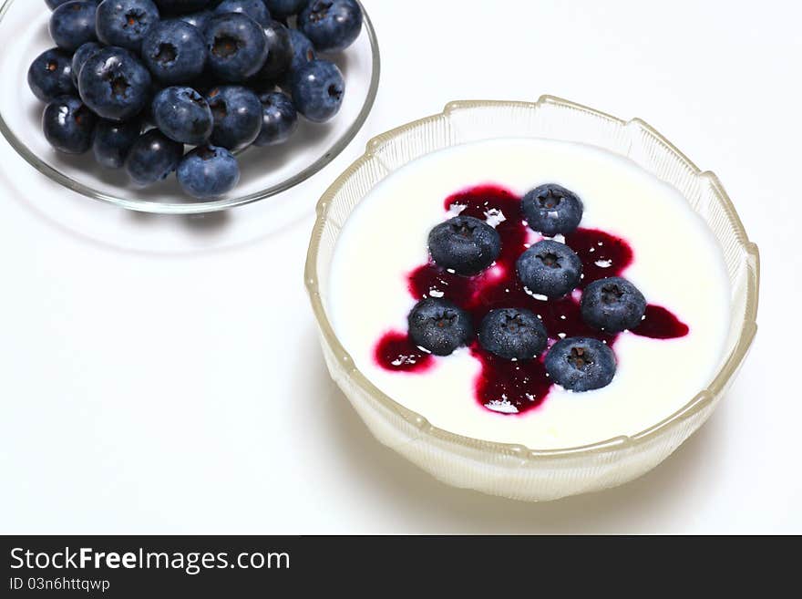 Picture of natural blueberry on creamy yogurt. Picture of natural blueberry on creamy yogurt