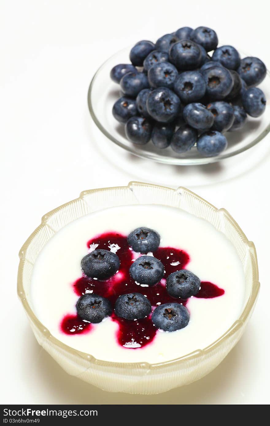 Picture of natural blueberry on creamy yogurt. Picture of natural blueberry on creamy yogurt