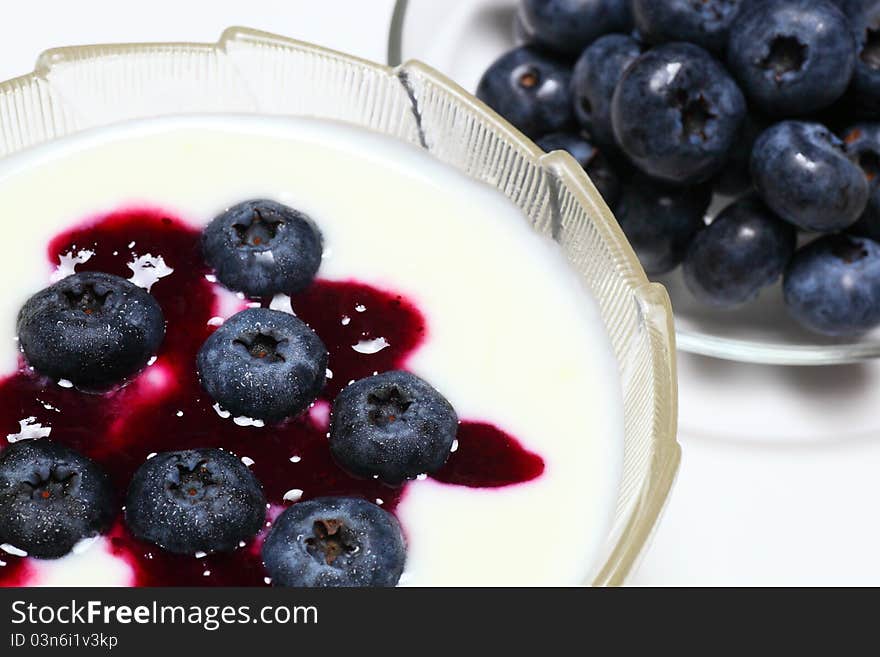 Picture of natural blueberry on creamy yogurt. Picture of natural blueberry on creamy yogurt