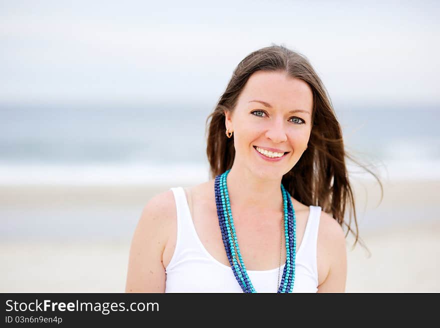 Portrait of a beautiful brunette woman with a necklace. Portrait of a beautiful brunette woman with a necklace