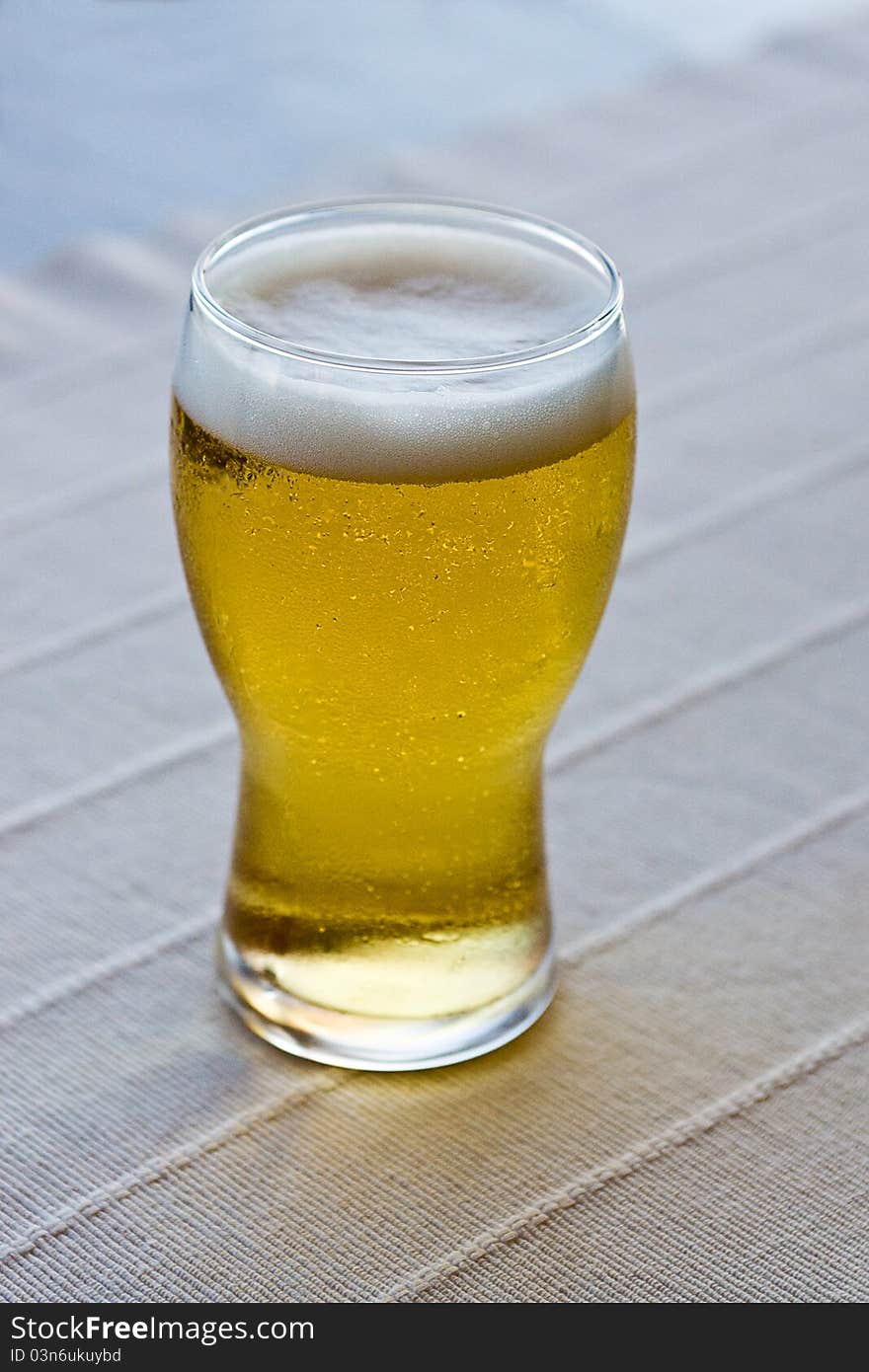 Glass of beer on table