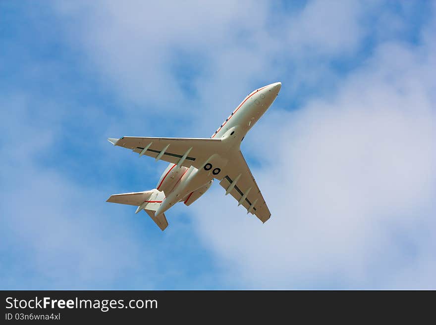 A business jet after take off, pictured form below