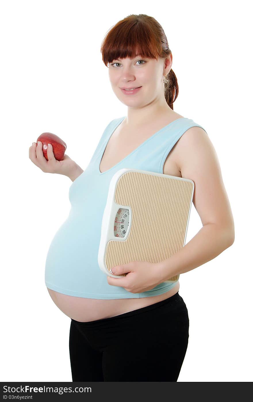 Pregnant Woman With A Measuring Tape