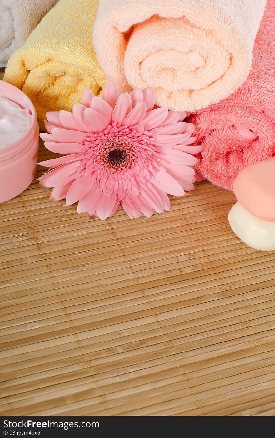 Pink gerbera and a towel