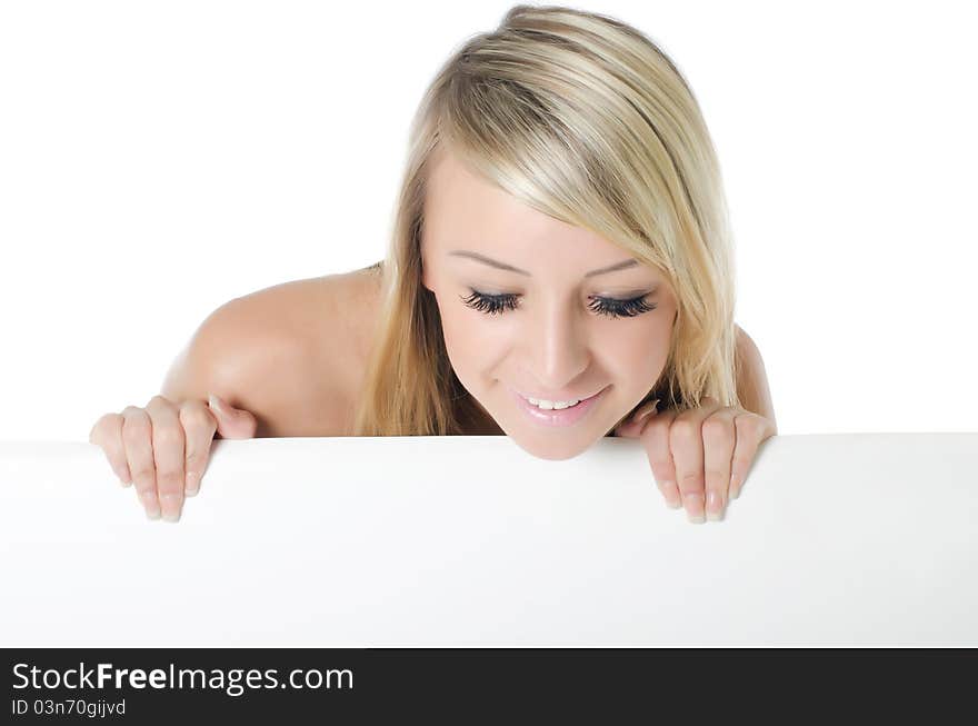 Portrait of woman holding a blank billboard on white