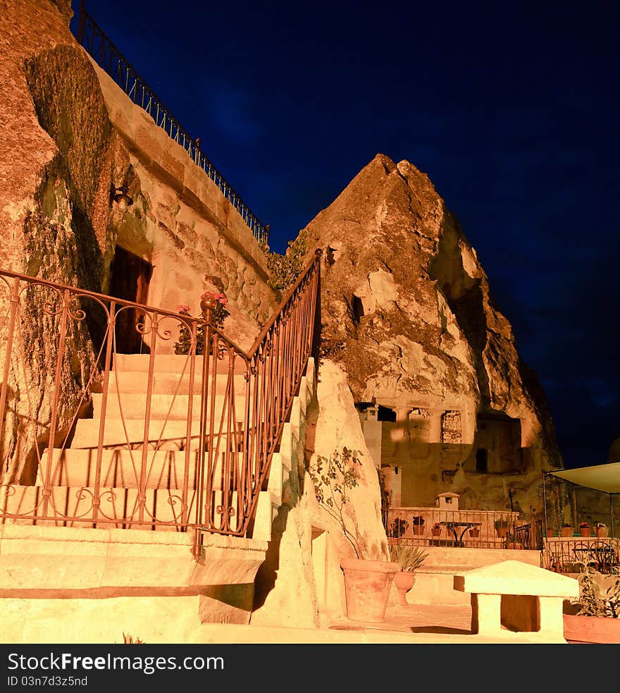 Night scene of exterior steps leading to rooms