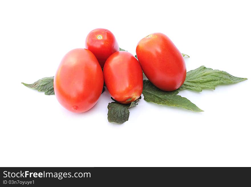 Fresh tomatoes on a white background close-up isolated